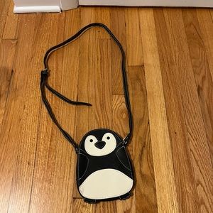 Black and white penguin cross body bag.